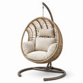 Sillón colgante de ratán sintético beige con cojines y estructura de acero