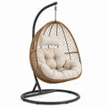 Sillón colgante de ratán sintético beige con estructura de acero